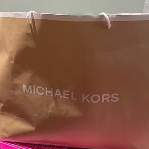 MK black his/her backpack